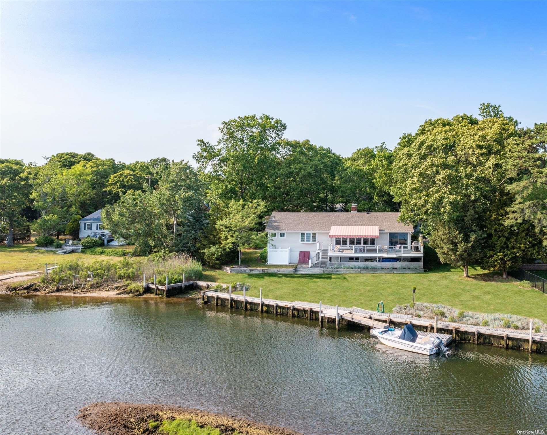 a view of an ocean with residential houses with outdoor space