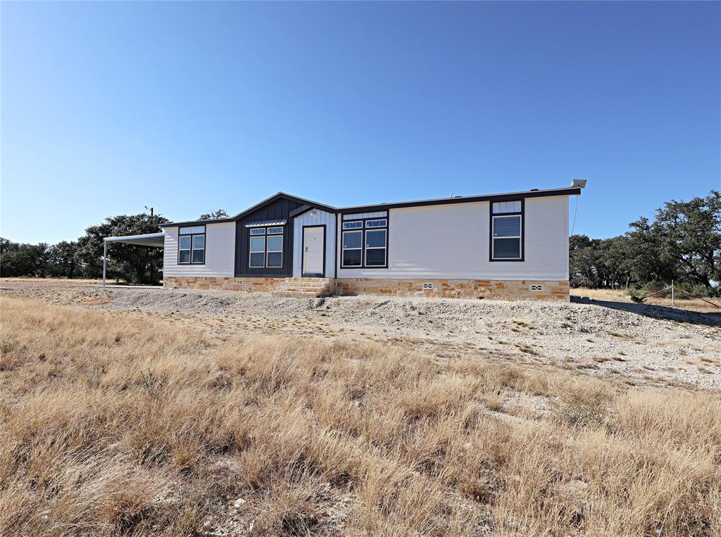 This is a 3BR-2Bath modern single-story home featuring a blend of siding and stone exterior, large windows, a covered carport and covered patio, set on 100 acres of beautiful landscape! Wether you are looking to hunt, hike, to simply relax, this expansive property is your personal retreat into the Texas wilderness.