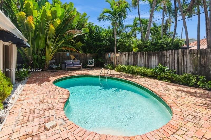 a view of a swimming pool with a patio