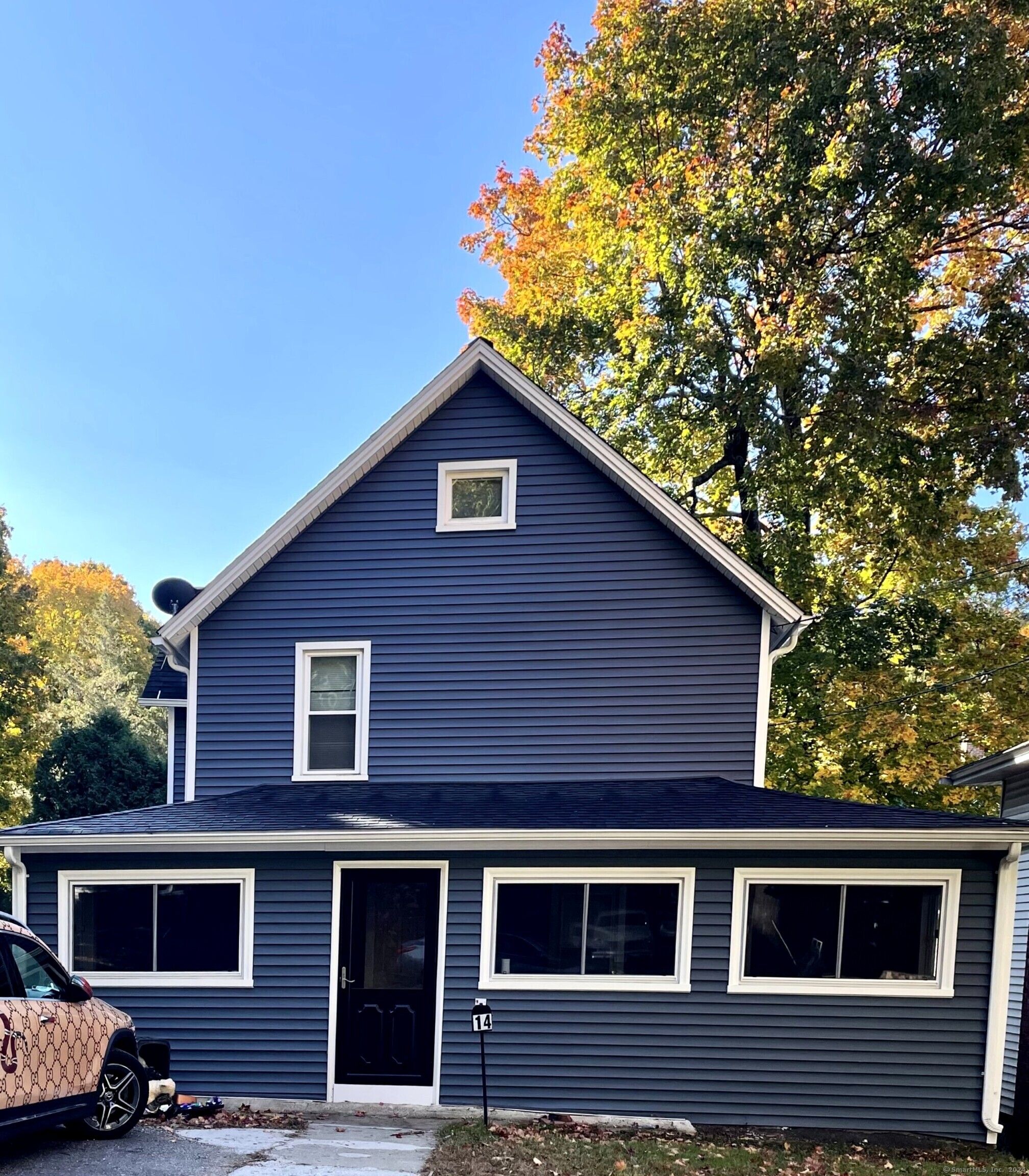 a front view of a house with yard