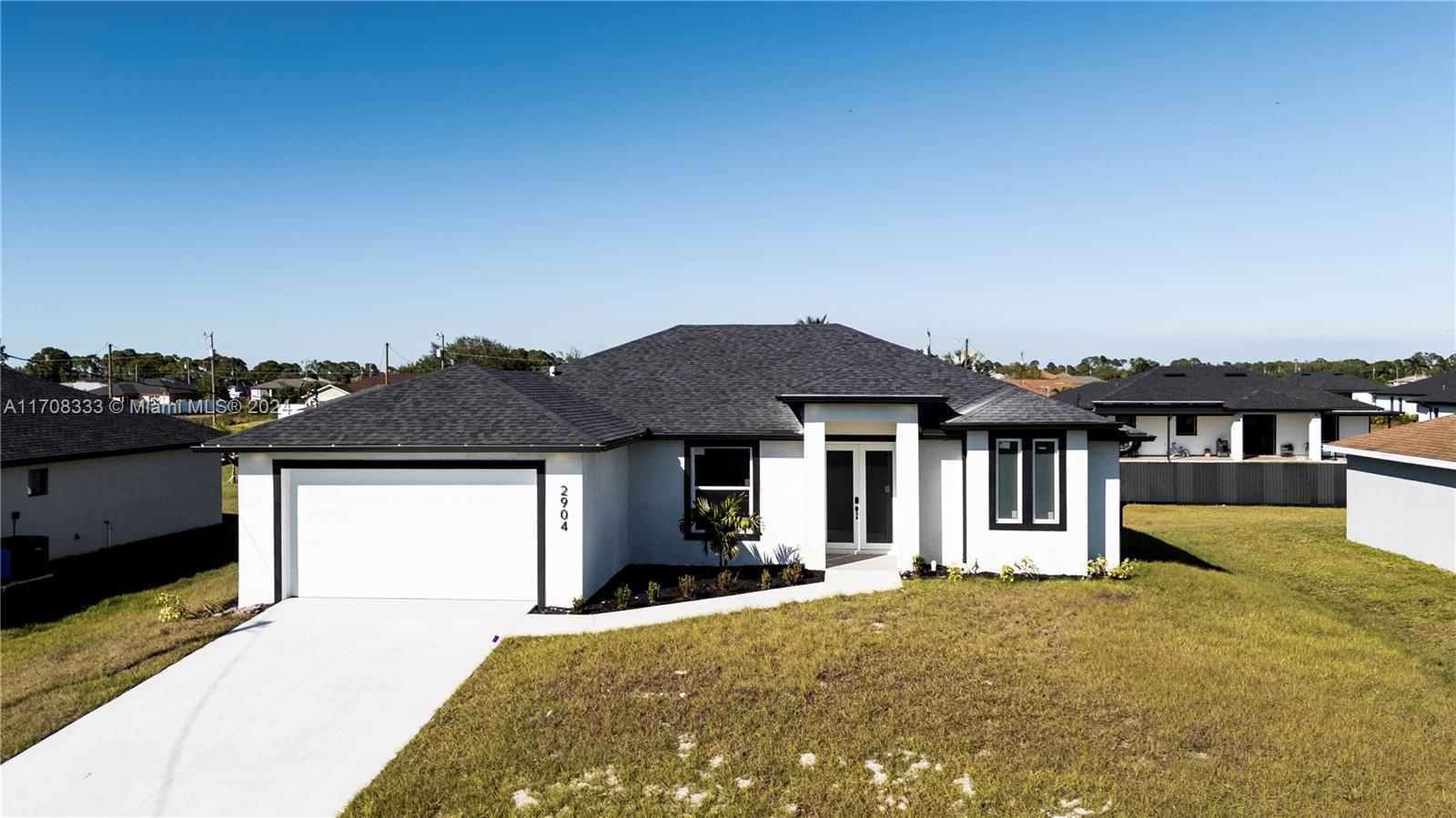 a front view of a house with a yard