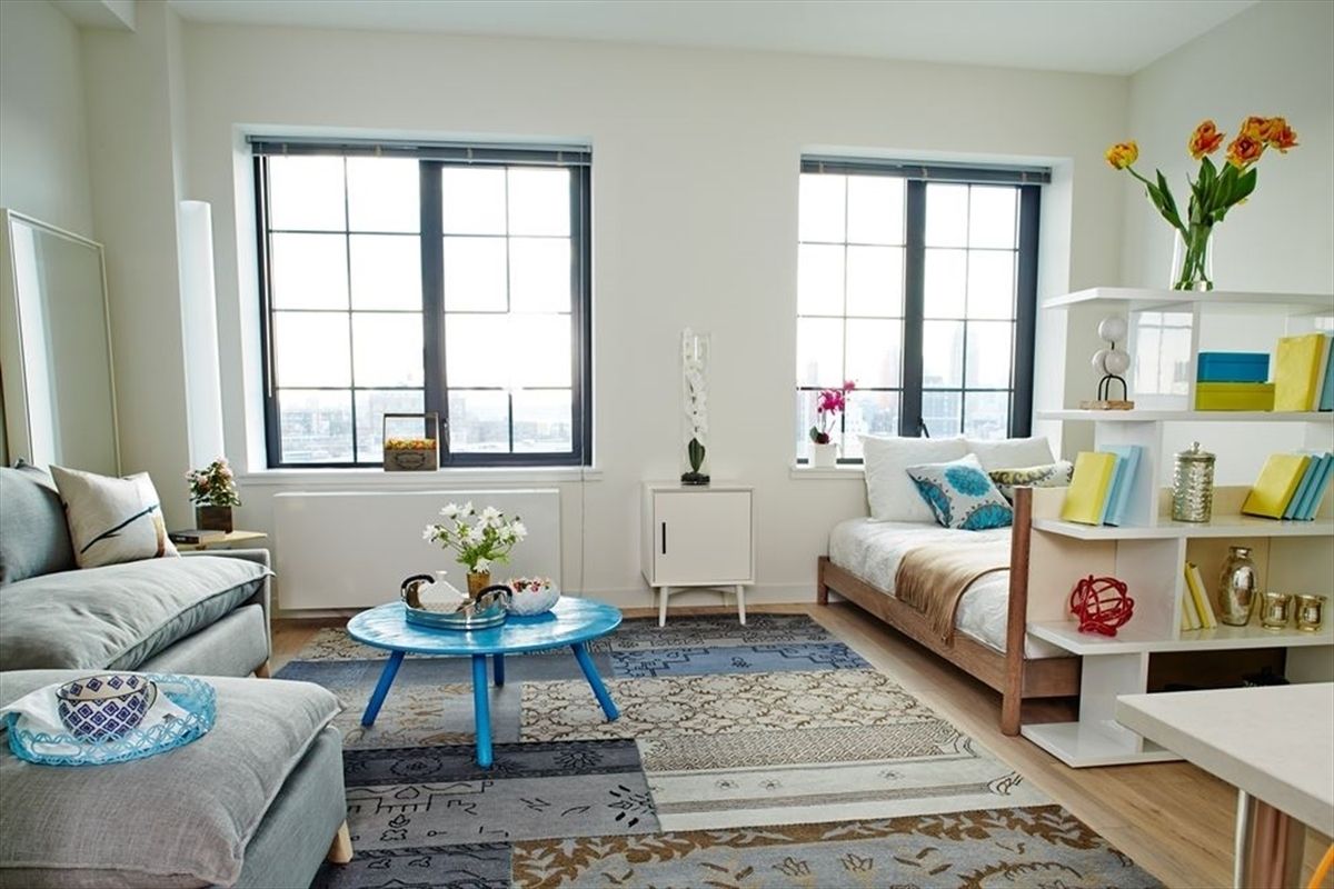 a living room with furniture and window