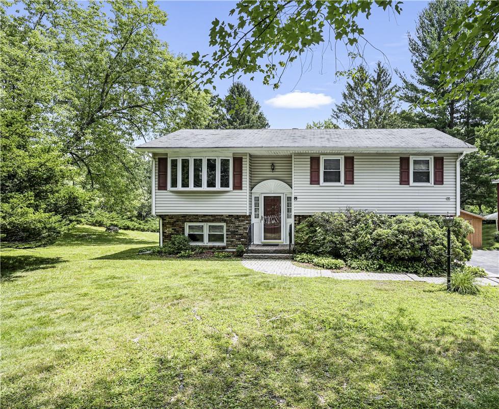 Raised ranch with a front yard