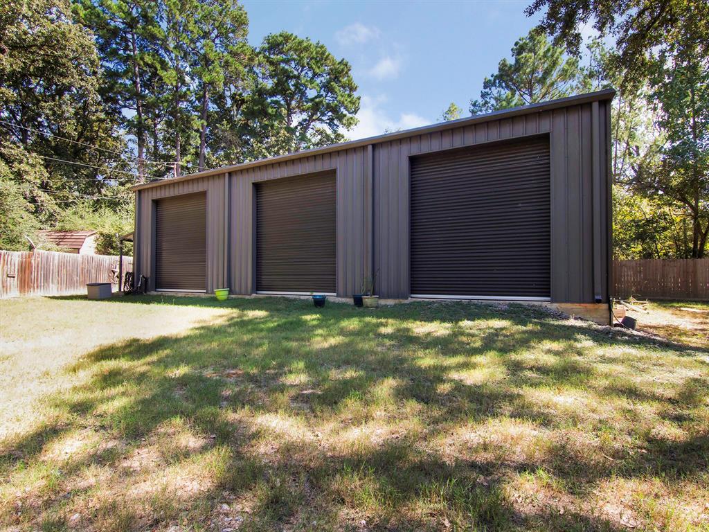 a view of a house with a yard and garage