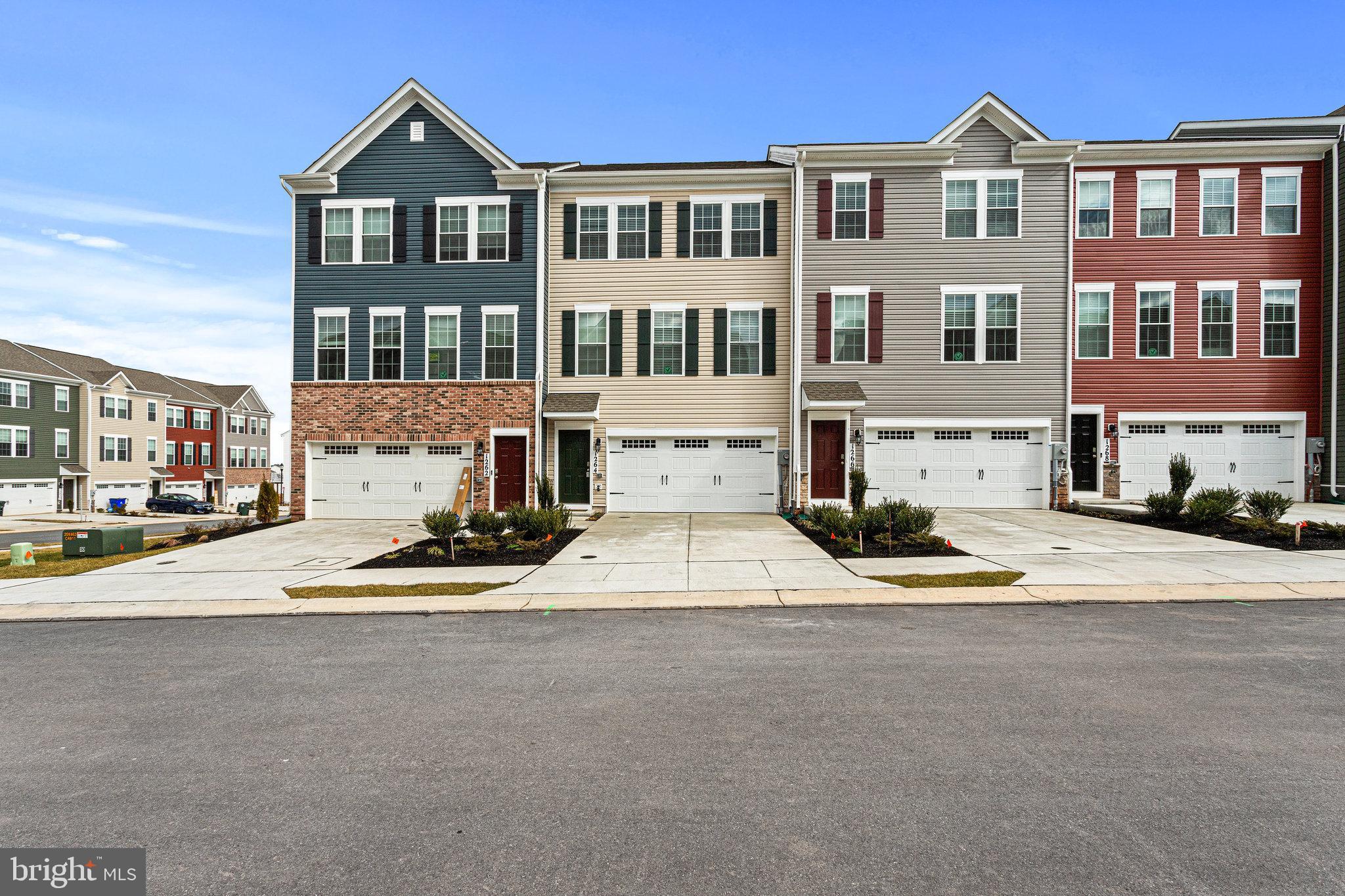 a view of multiple houses with a street