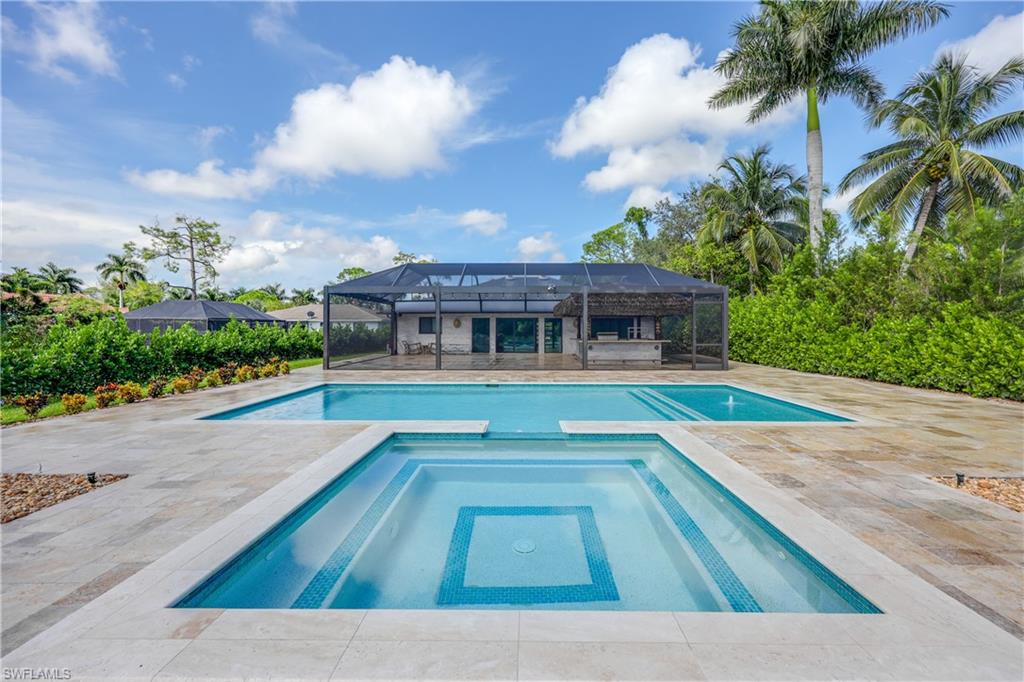 a view of house with swimming pool