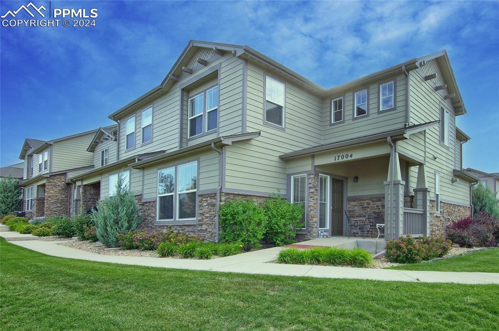 a front view of a house with a yard