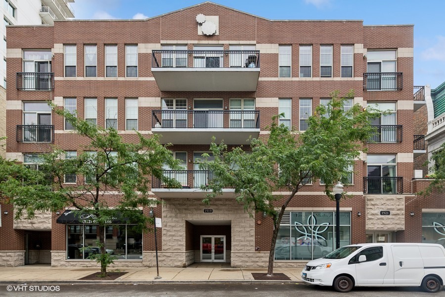 a view of a car parked in front of a building