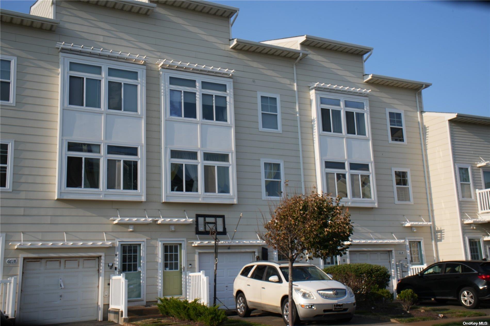 a front view of a building with parking space