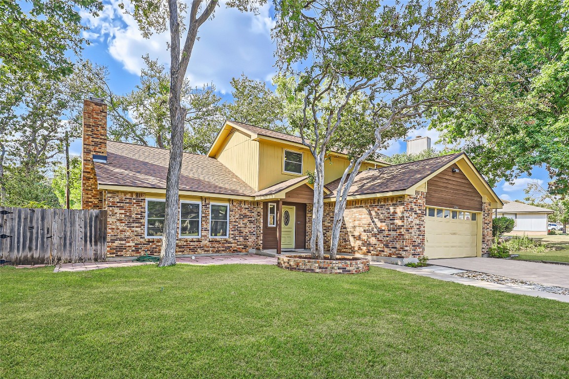 front view of a house with a yard