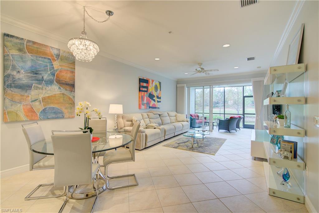 a very nice looking dining room with a large window