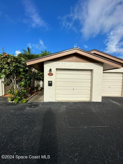 a front view of a house with a garage