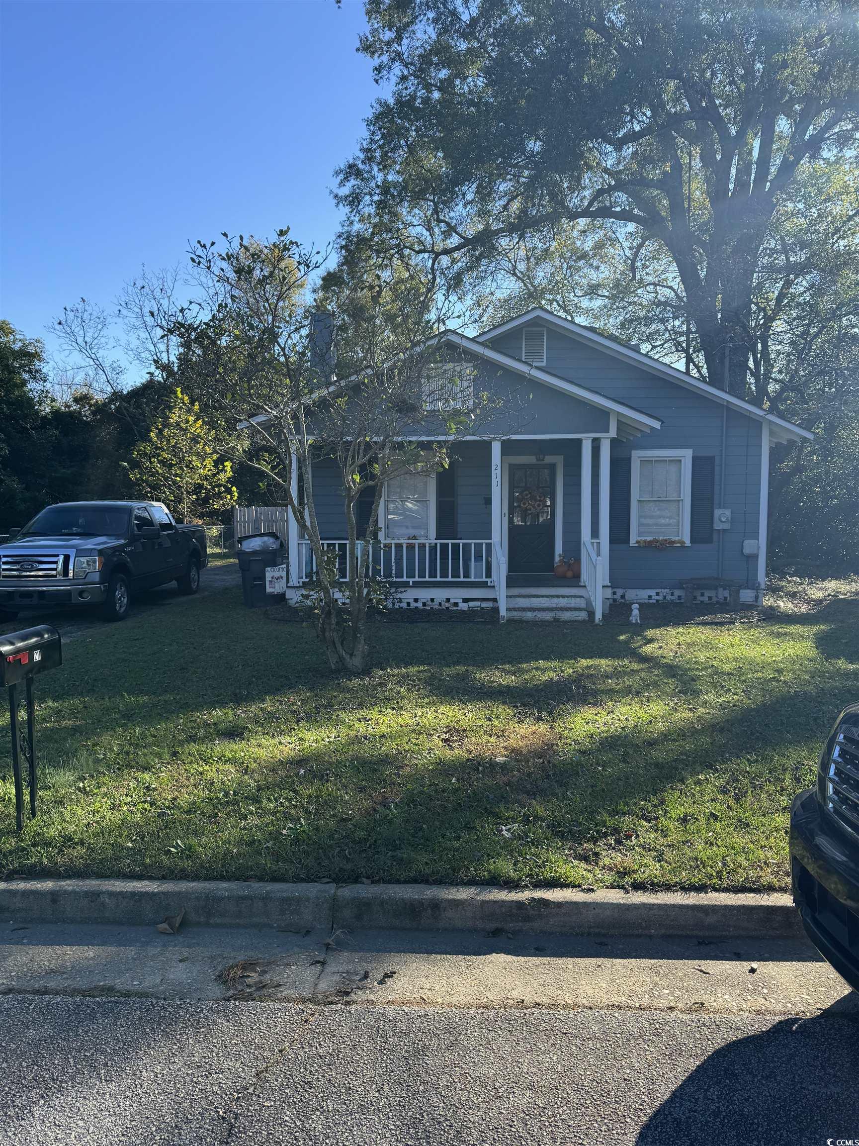 View of front of property featuring a front yard a