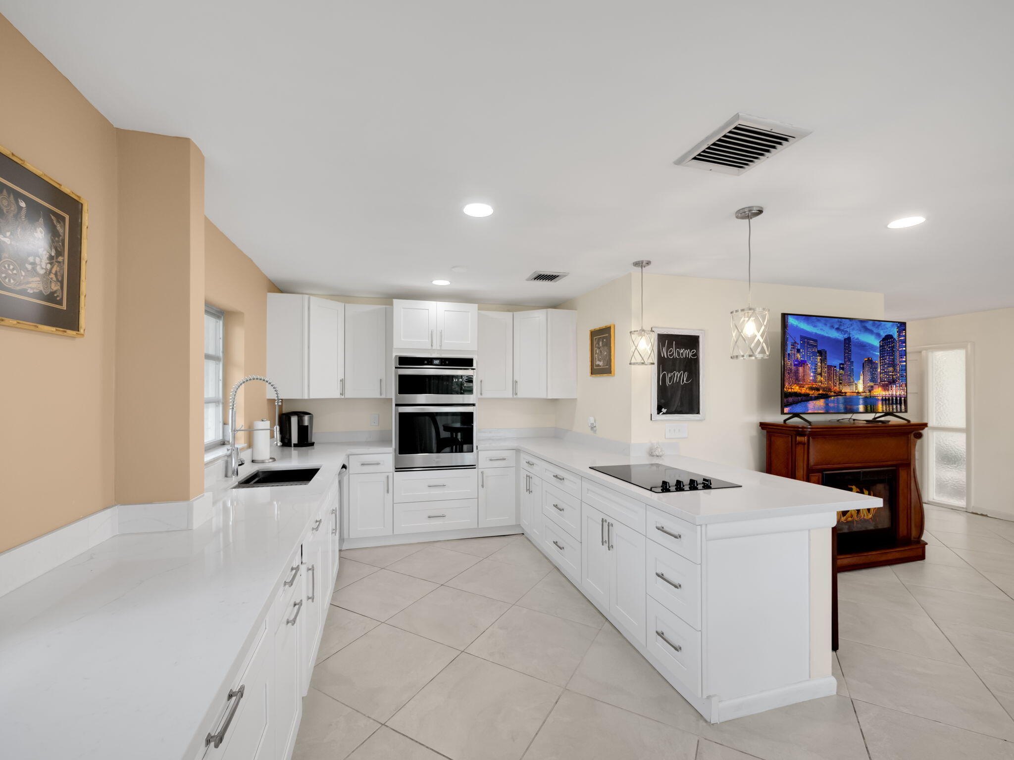 a kitchen with stainless steel appliances kitchen island granite countertop a sink and cabinets