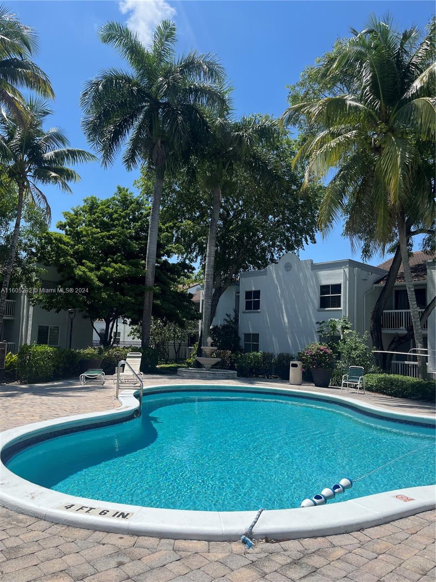 a house with palm tree in front of it