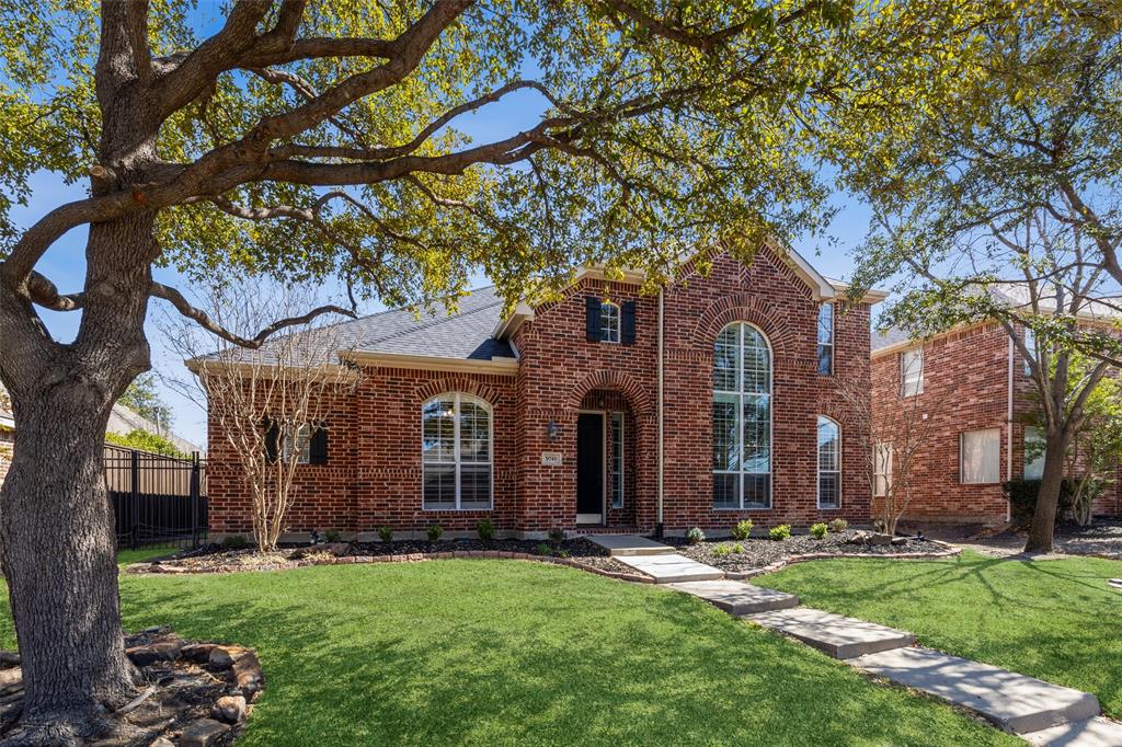 front view of a house with a yard