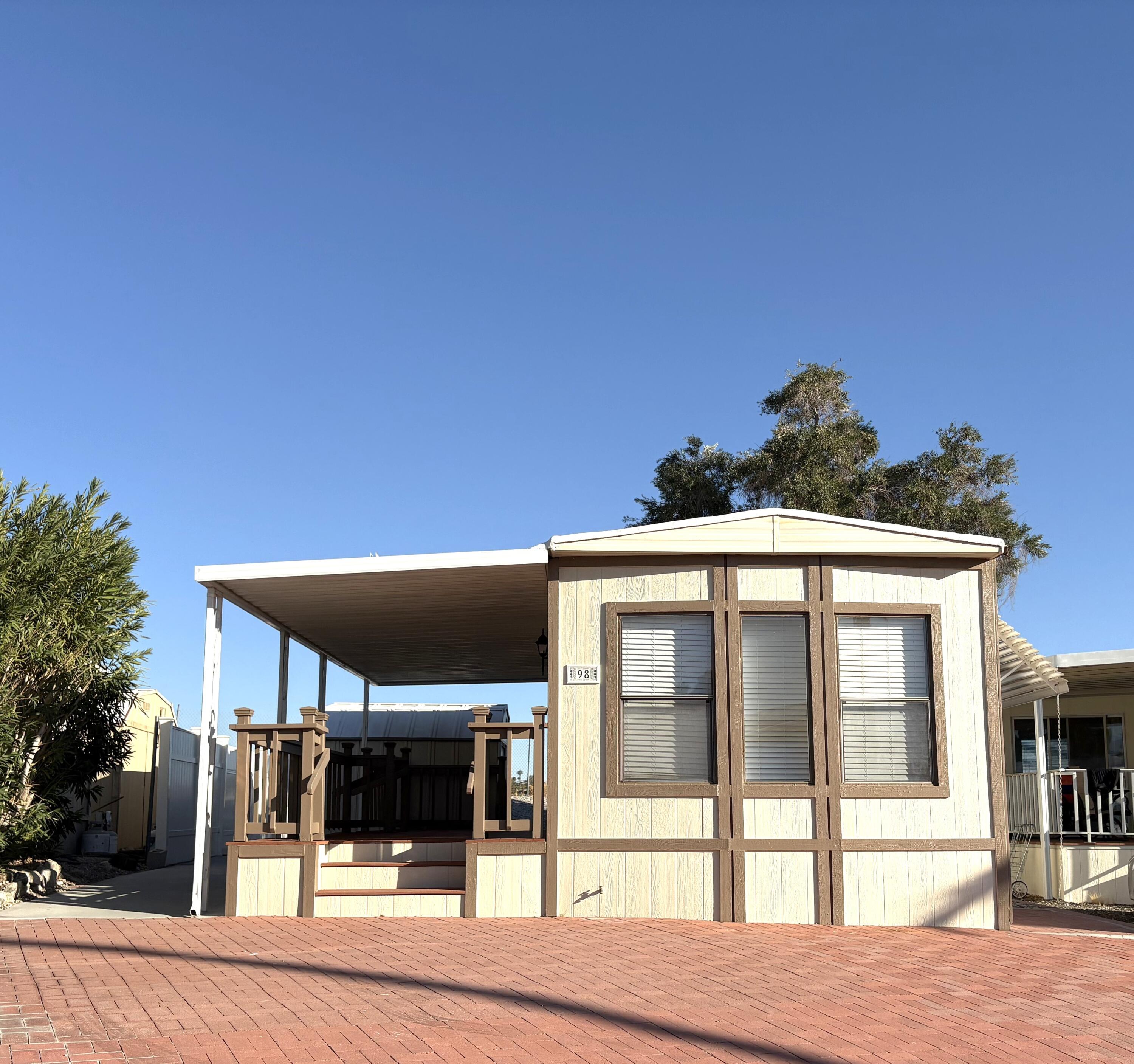 a front view of a house with a porch