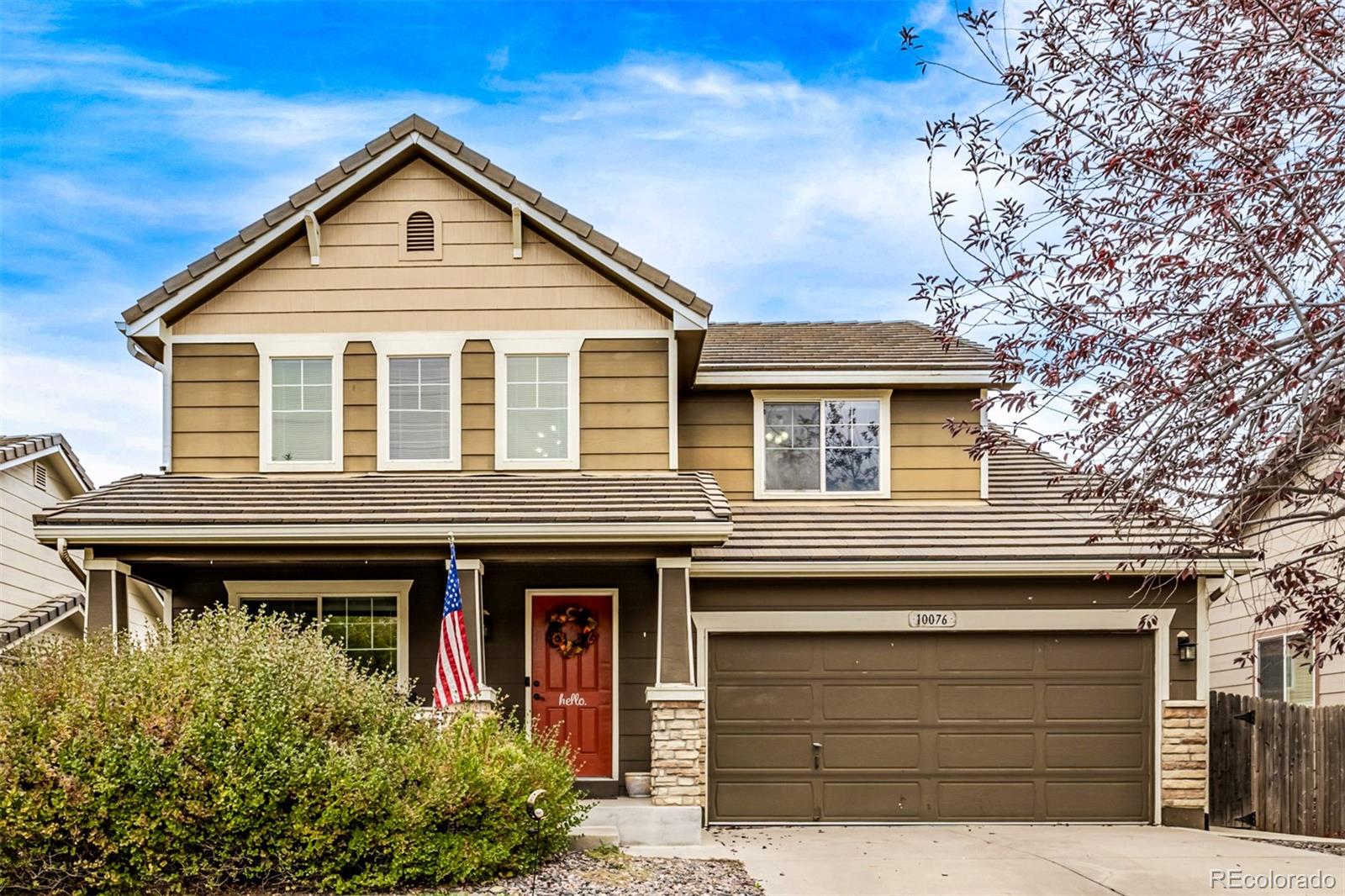 a front view of a house with garage