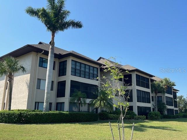 a front view of a building with garden