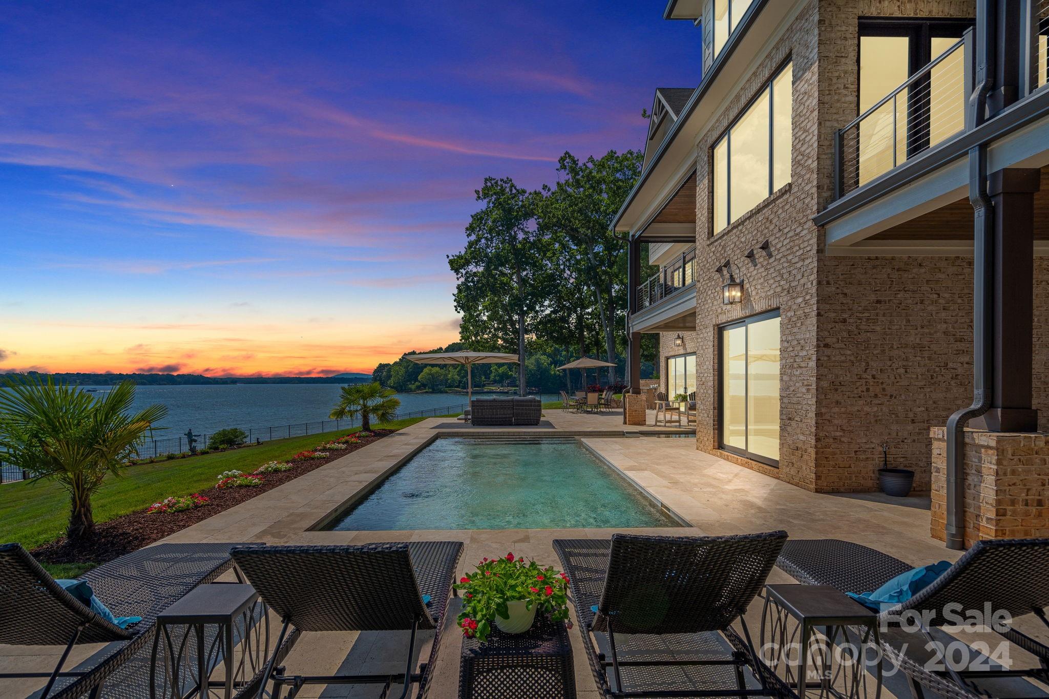 a view of a patio with dining table and chairs with a patio