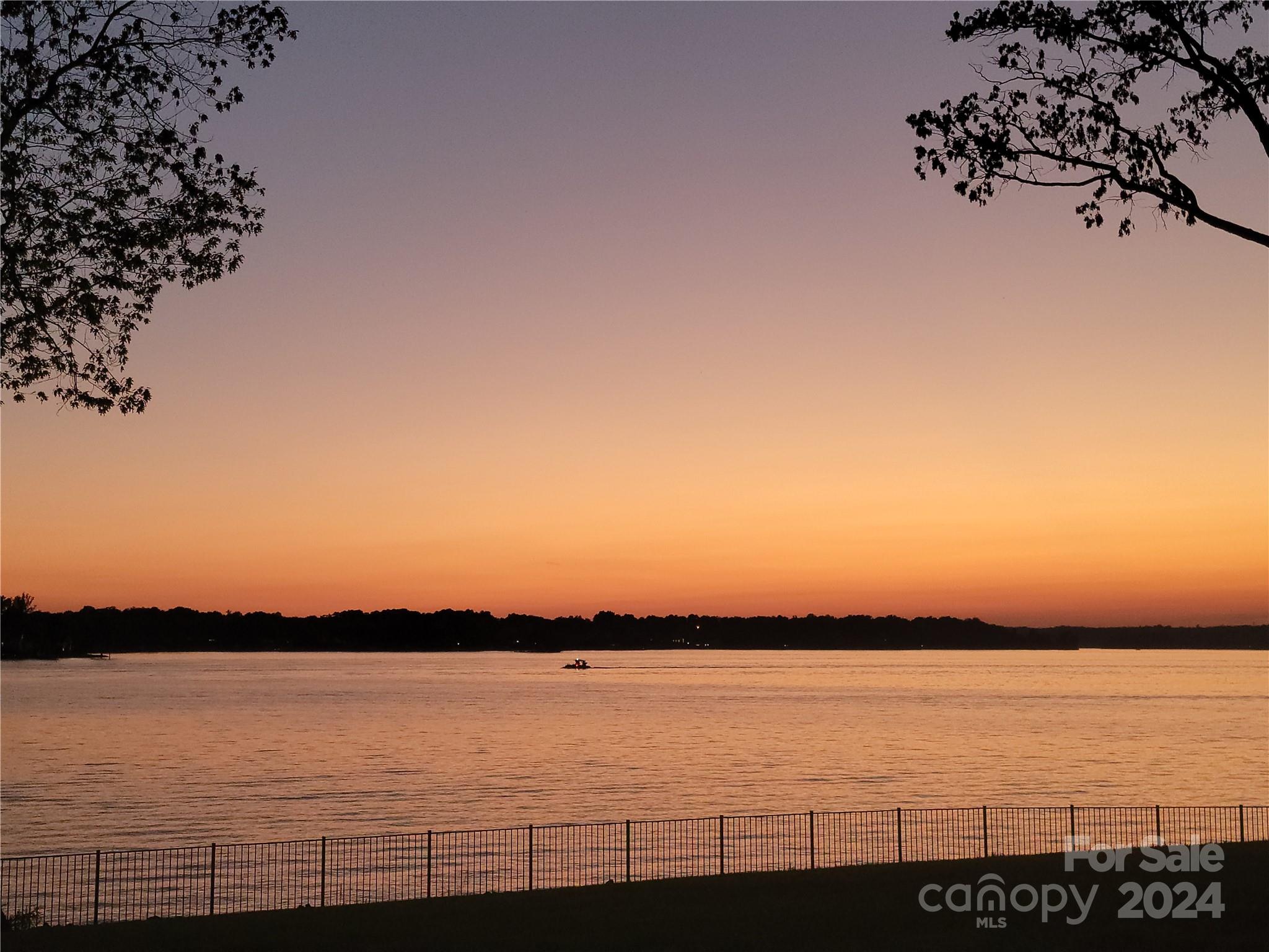 a view of a lake and sunset