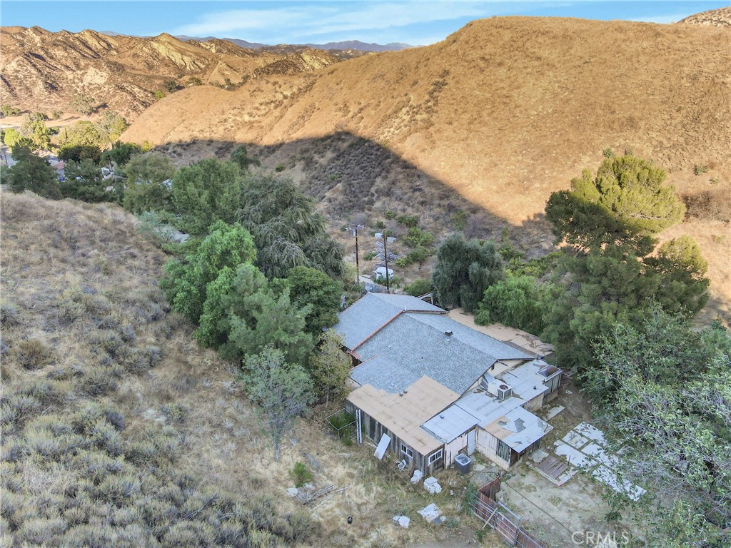 an aerial view of a house with mountain view