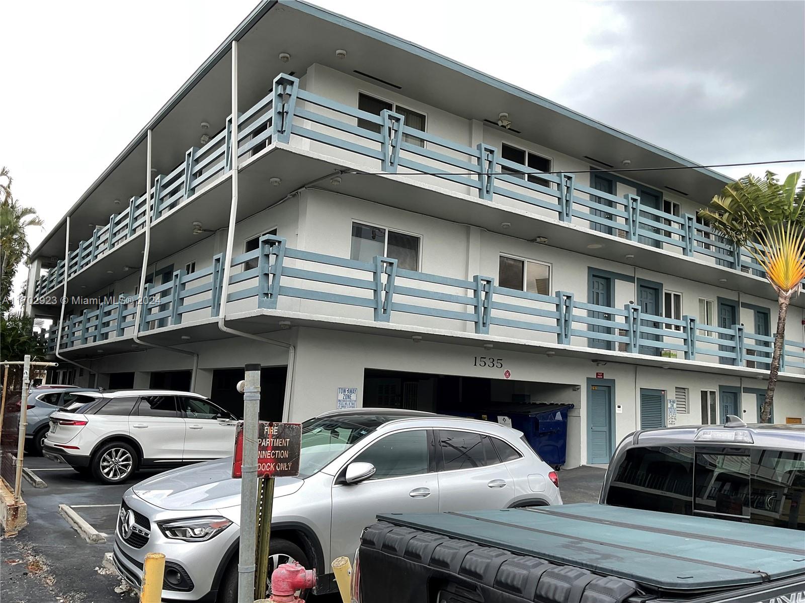 a front view of a house with parking space