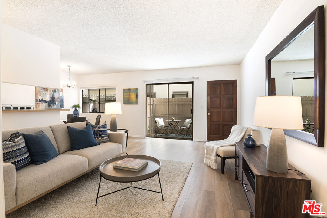 a living room with furniture and a coffee table