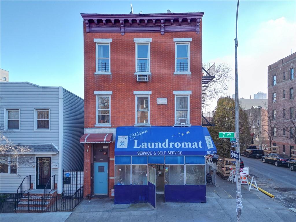 a red brick building with glass windows