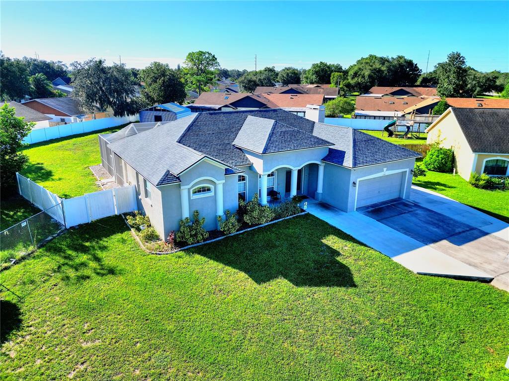 an aerial view of a house with a garden