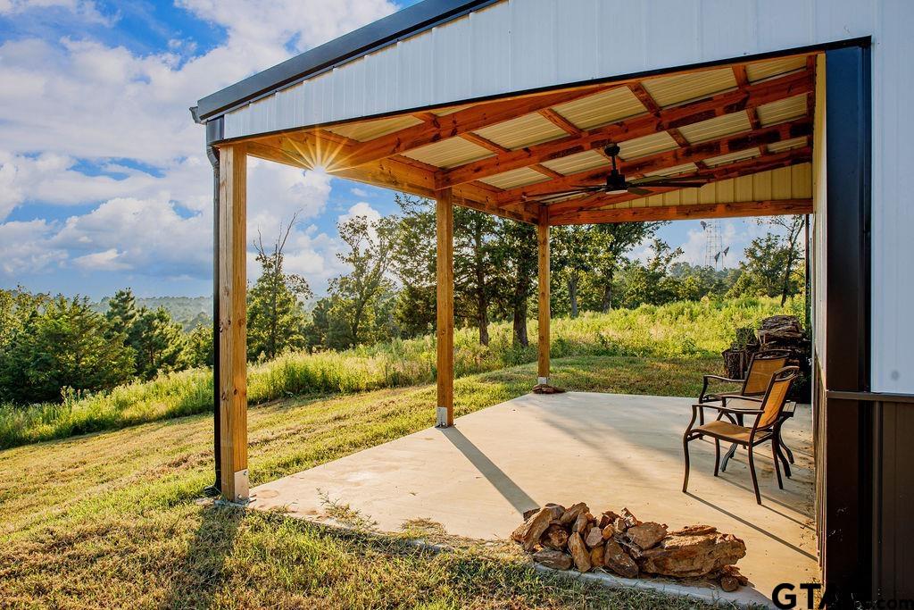 a backyard of a house with table and chairs