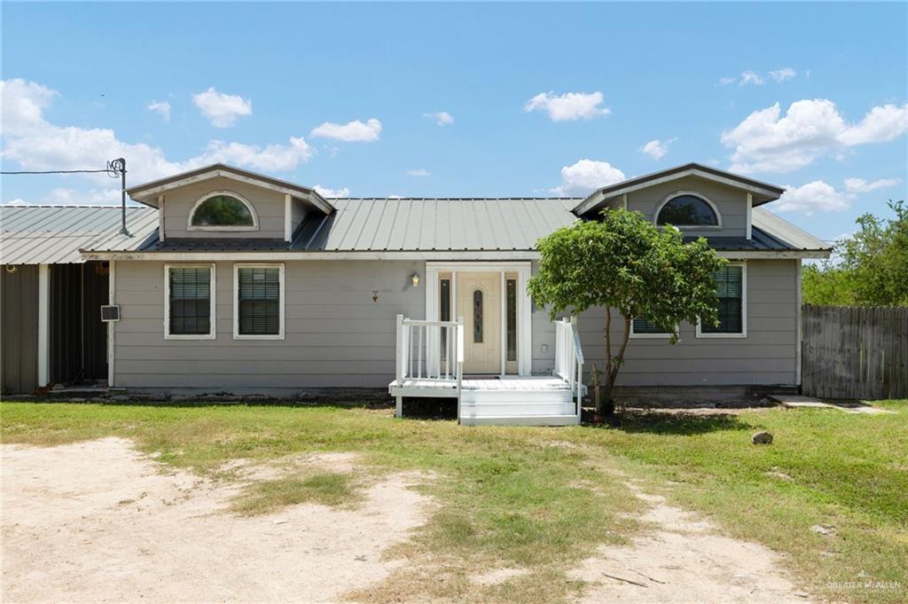 View of front of house with a front lawn