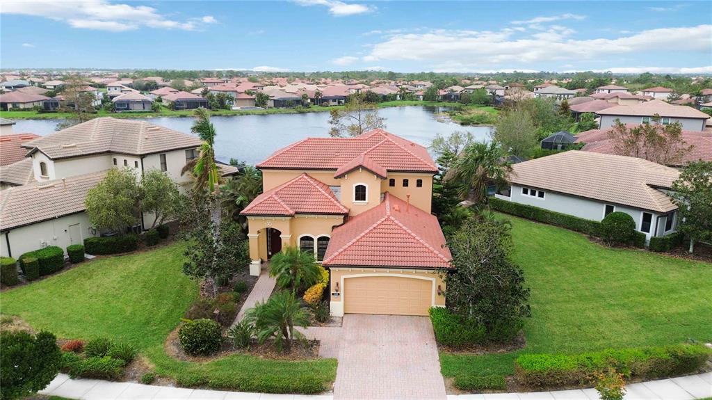 an aerial view of multiple houses with yard