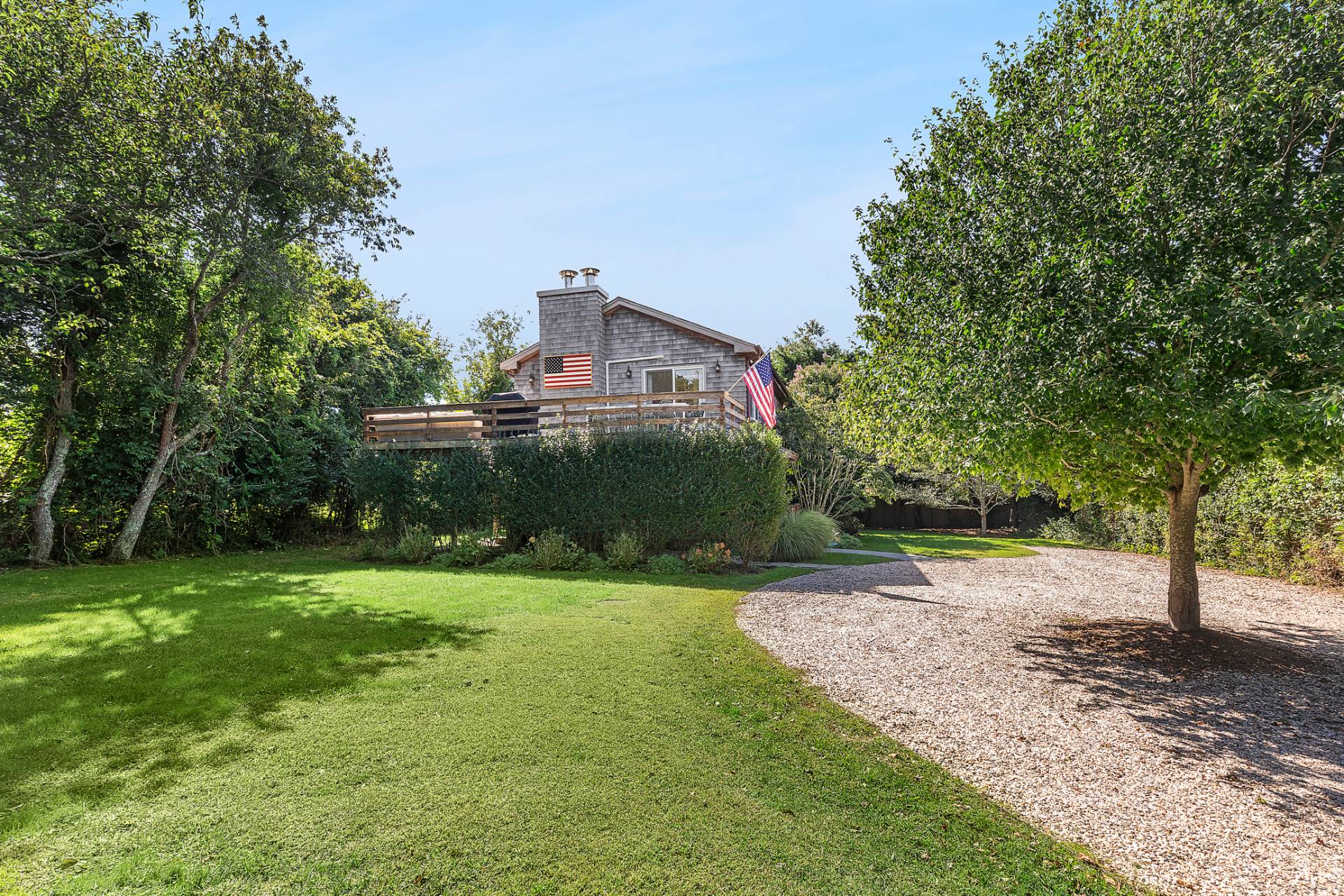 a view of a house with a yard and a garden