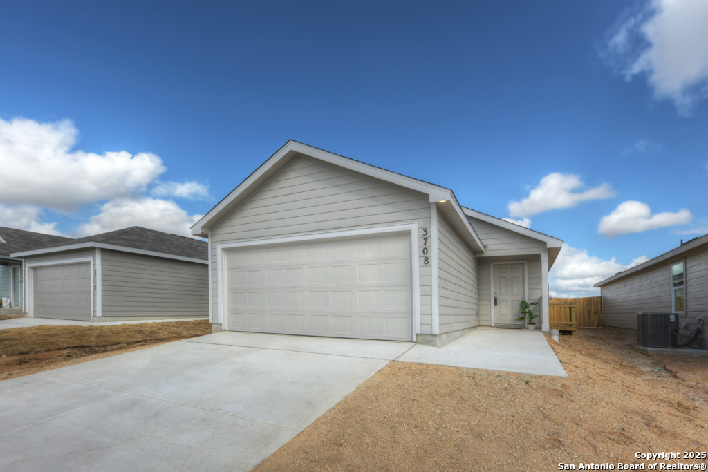 a view of garage yard and garage