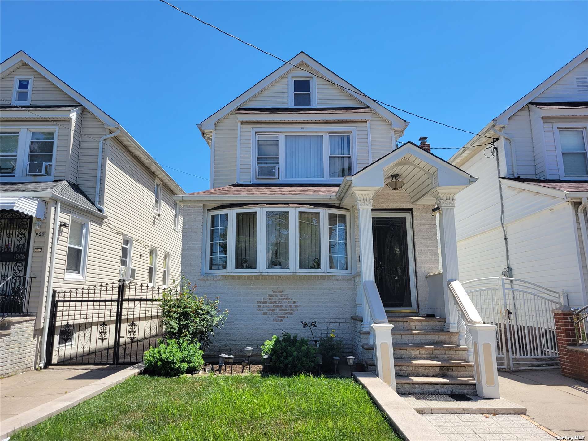 a front view of a house with a yard