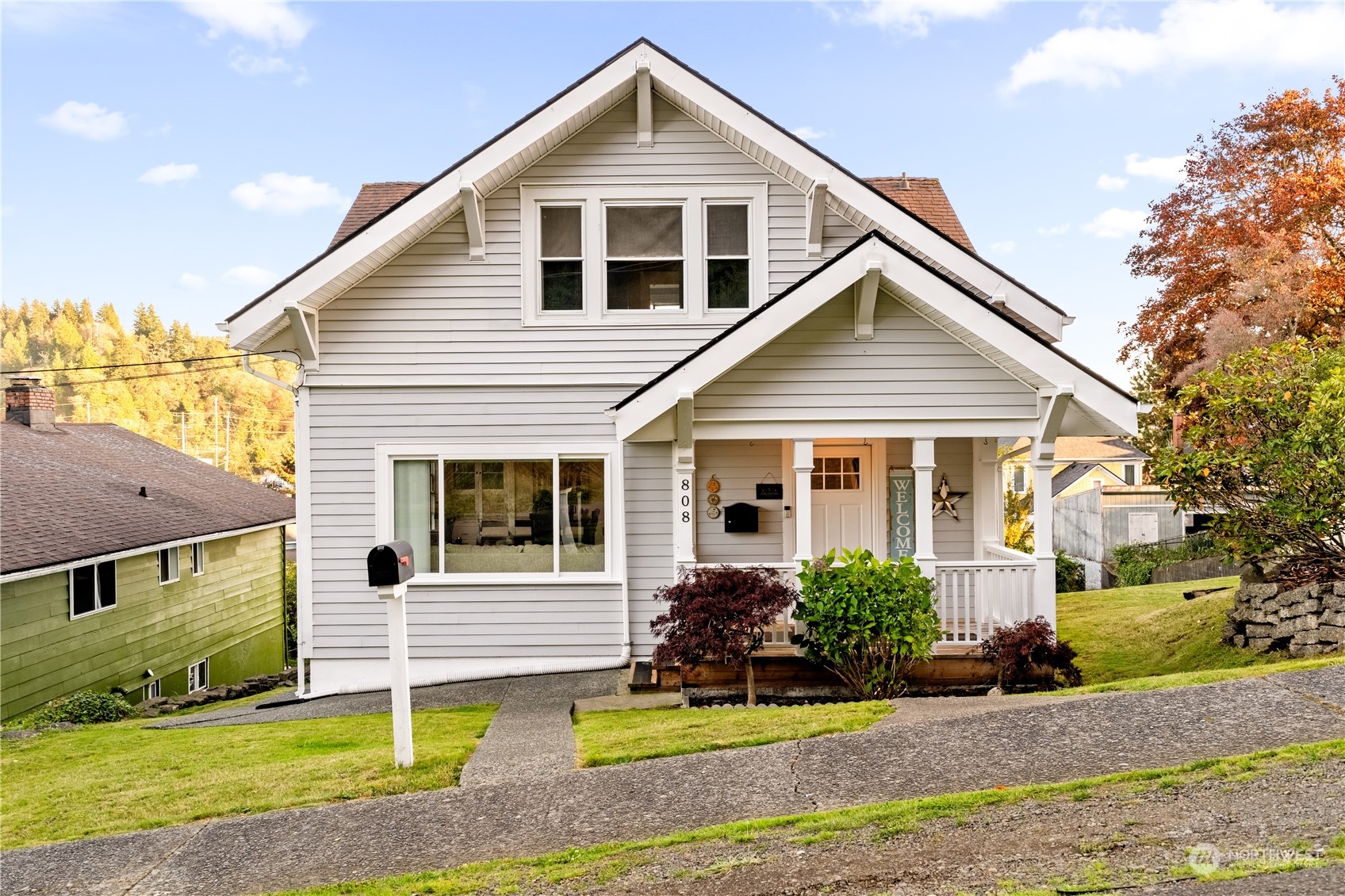 a front view of a house with a yard