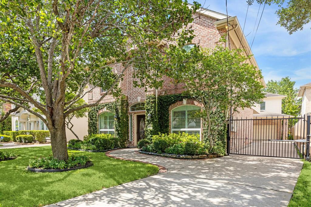 front view of a house with a tree