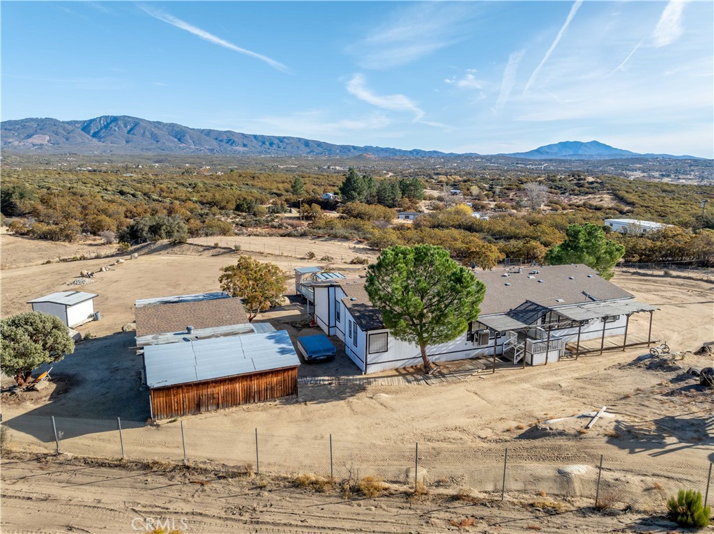 an aerial view of a house with a outdoor space