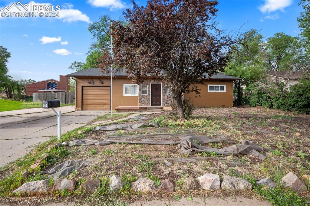 View of front of home featuring a garage