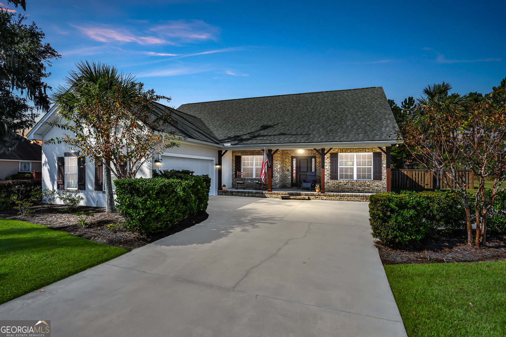 a view of a house with backyard and porch