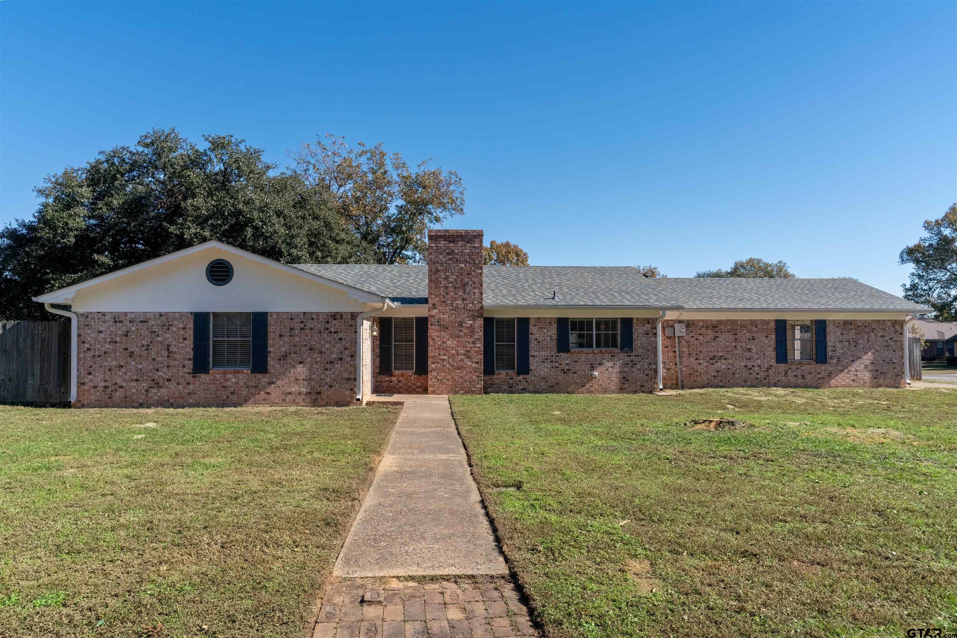 a front view of a house with yard