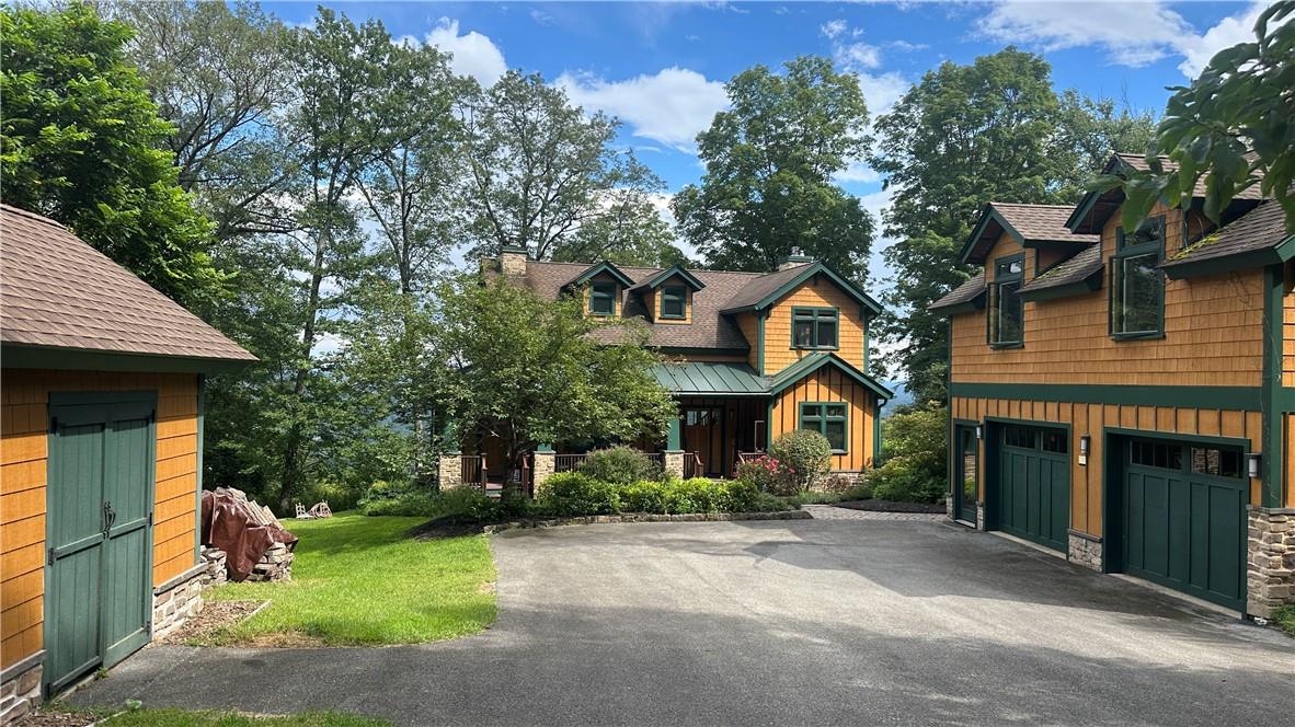 Front of the house with garage and shed