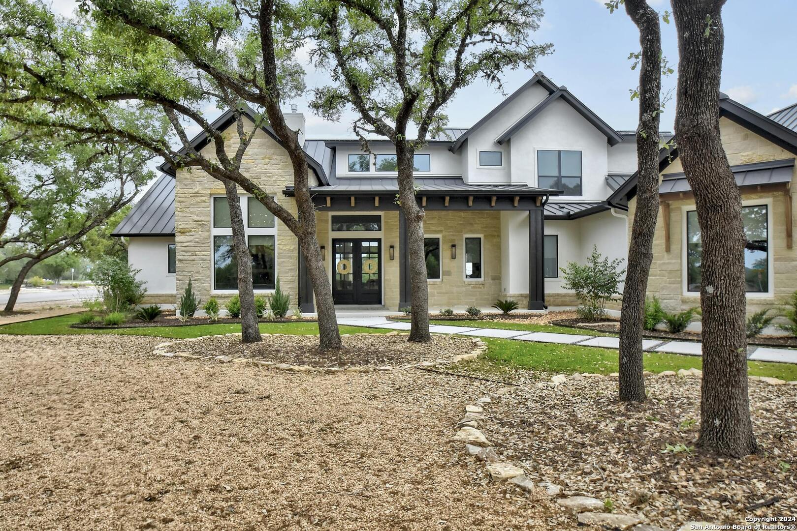 a front view of a house with a yard