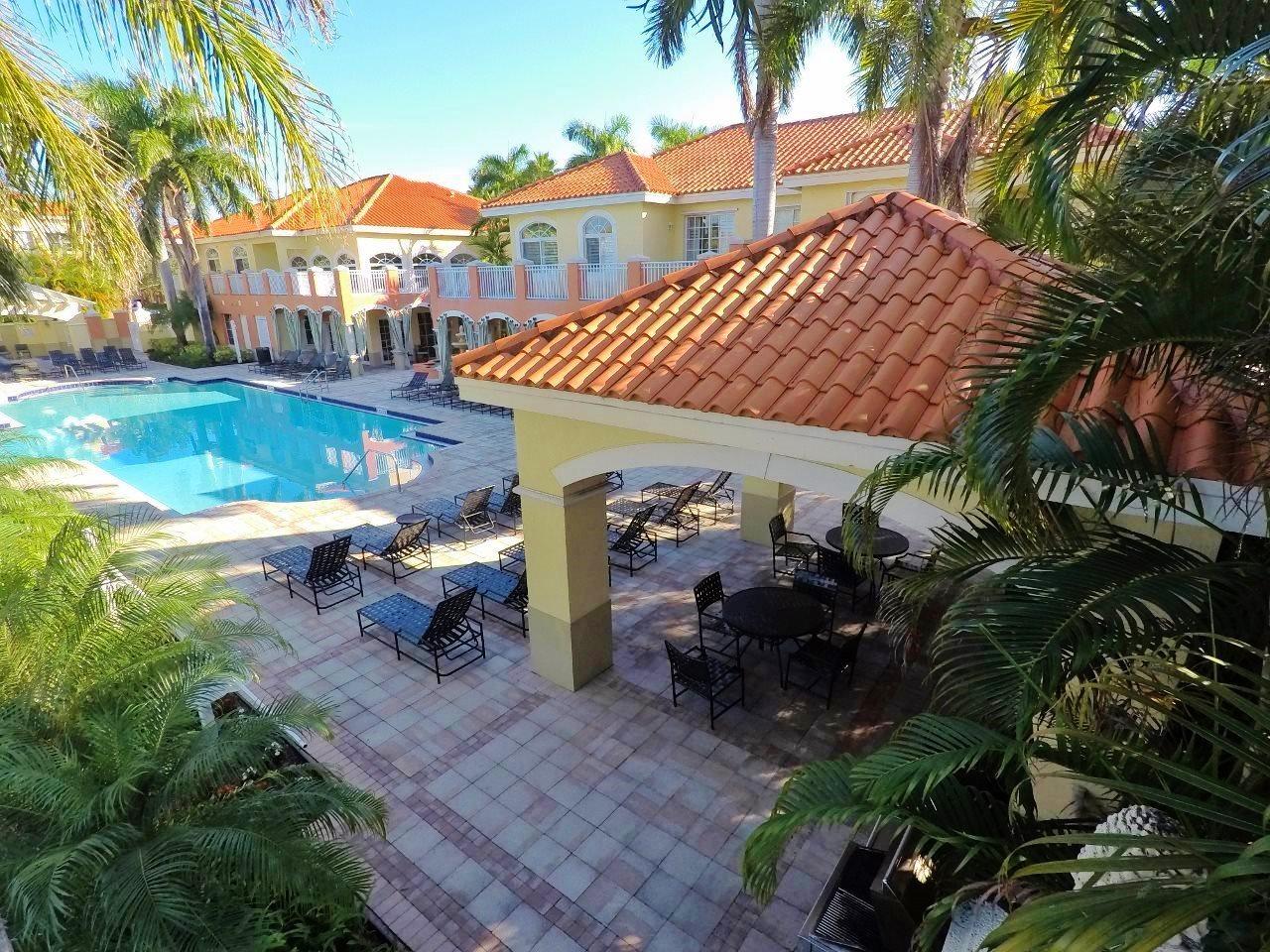 a view of a chairs and table in the patio