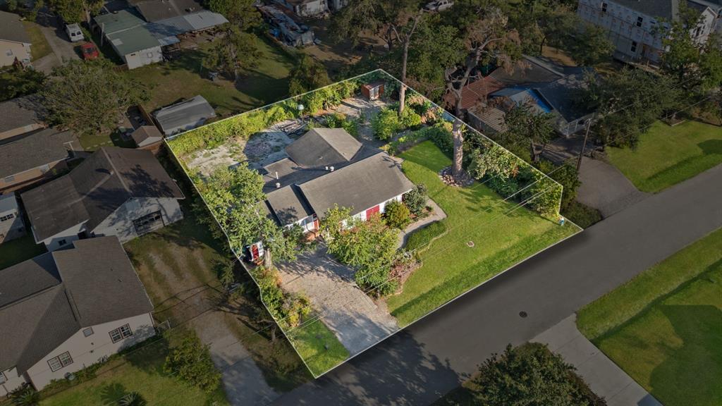 an aerial view of a residential houses with outdoor space