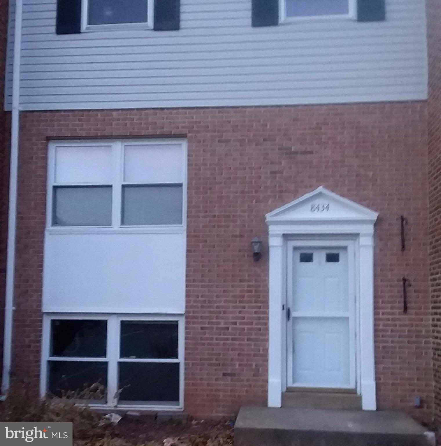 a front view of a house with garage