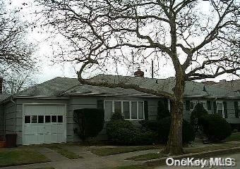 a view of house with yard