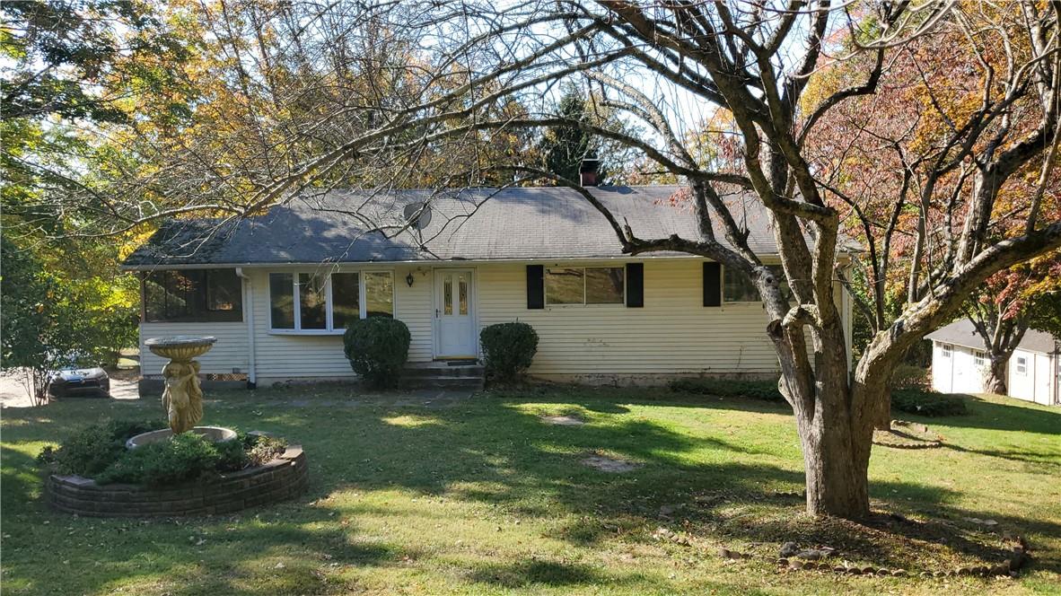 Ranch-style house on large corner lot property.