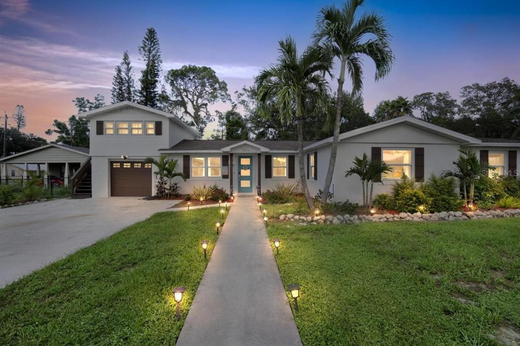 a front view of a house with a yard